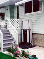 The homeowner built their own gate for this porch lift.